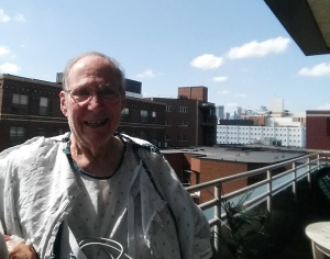 Dad out enjoying the hospital balcony.  I spent a lot of post-surgery time here myself last July!